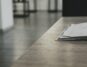 Bright, modern desk with neatly laid out architectural blueprints, a laptop, and a cup of coffee, symbolizing the planning...